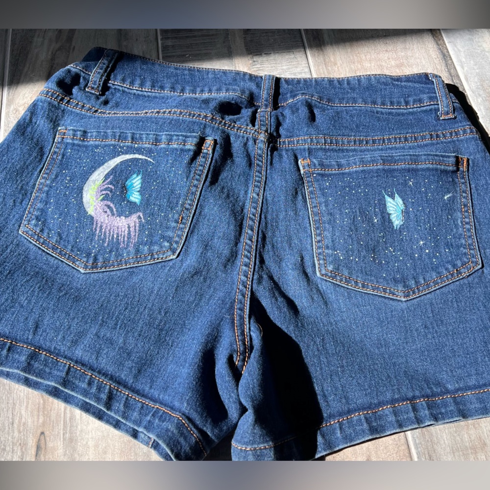 Repurposed denim shorts with hand painted details on the pockets. - Picture 2 of 3